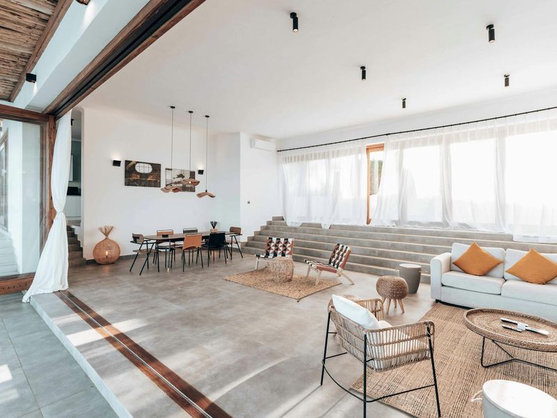 Bright minimalist training room with orange accents and large windows