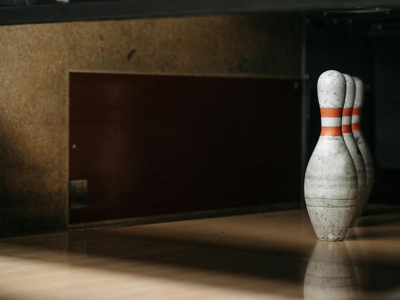 Close up of sports equipment on a dark wooden floor